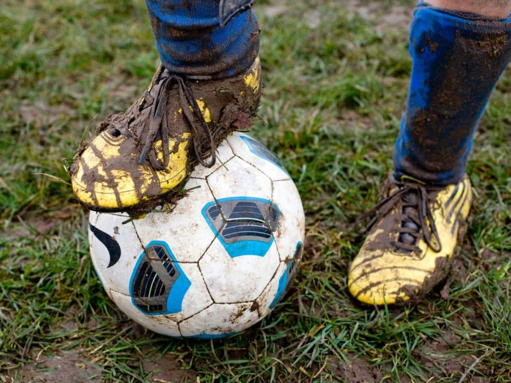 How Do I Prevent My Football Cleats From Getting Too Muddy?